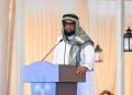 President Irfaan Ali, wearing the keffiyeh. while delivering the feature address to the gathering at the Muslim Youth Organisation