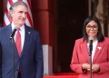 Venezuela's interim president Delcy Rodríguez (R) speaks alongside US Secretary of the Interior Doug Burgum in Caracas