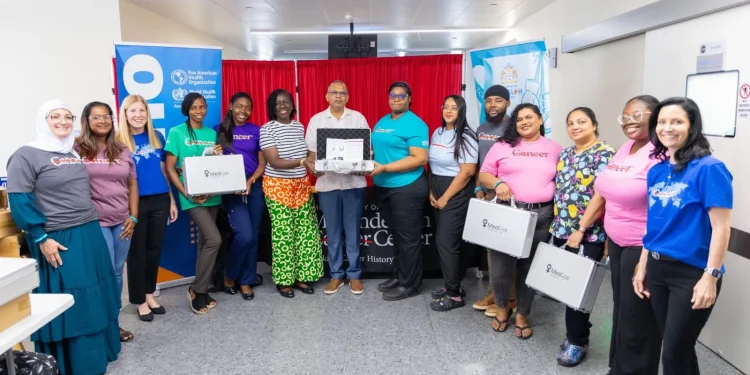Minister of Health Dr Frank Anthony hands over the thermal ablation devices (DPI photo)