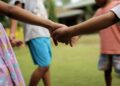 UNICEF/Joshua Estey Children play outside their home at a shelter in the Philippines.