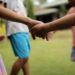 UNICEF/Joshua Estey Children play outside their home at a shelter in the Philippines.