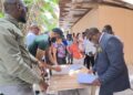 Residents of Friendship EBD residents with APNU MPs attorney-at-law Dr. Dexter Todd (in suit) and Saiku Andrews (black cap) APNU face book photo