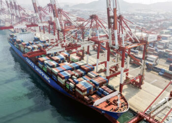 A cargo ship is docked at the foreign trade container terminal of Qingdao Port in China's eastern Shandong province on Wednesday. AFP/Getty Images