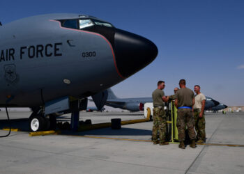 FILE PHOTO: U.S. Air Force Airmen from the 28th Expeditionary Air Refueling Squadron conduct a pre-flight brief outside of a KC-135 Stratotanker, before an aerial refueling mission in Al Udeid Air Base, Qatar, in this undated handout picture released by U.S. Air Force on August 1, 2019. Chris Drzazgowski/U.S. Air Force/Handout via REUTERS ATTENTION EDITORS- THIS IMAGE HAS BEEN SUPPLIED BY A THIRD PARTY./File Photo