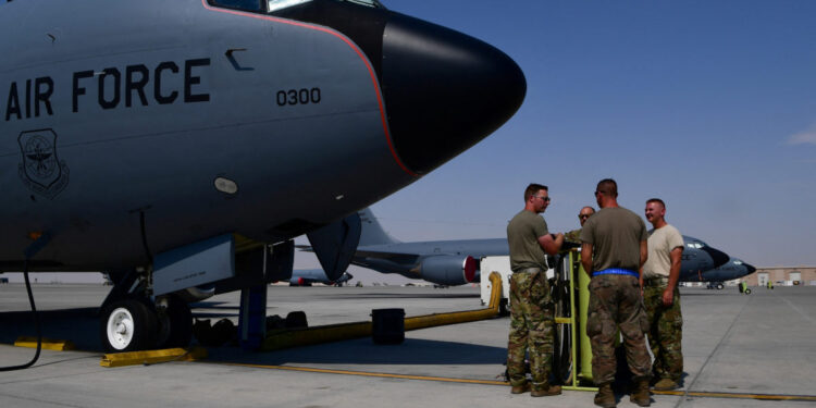 FILE PHOTO: U.S. Air Force Airmen from the 28th Expeditionary Air Refueling Squadron conduct a pre-flight brief outside of a KC-135 Stratotanker, before an aerial refueling mission in Al Udeid Air Base, Qatar, in this undated handout picture released by U.S. Air Force on August 1, 2019. Chris Drzazgowski/U.S. Air Force/Handout via REUTERS ATTENTION EDITORS- THIS IMAGE HAS BEEN SUPPLIED BY A THIRD PARTY./File Photo