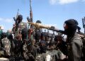 File Photo: Armed al-Shabab fighters ride on pickup trucks outside Mogadishu, Somalia, on December 8, 2008. /CFP