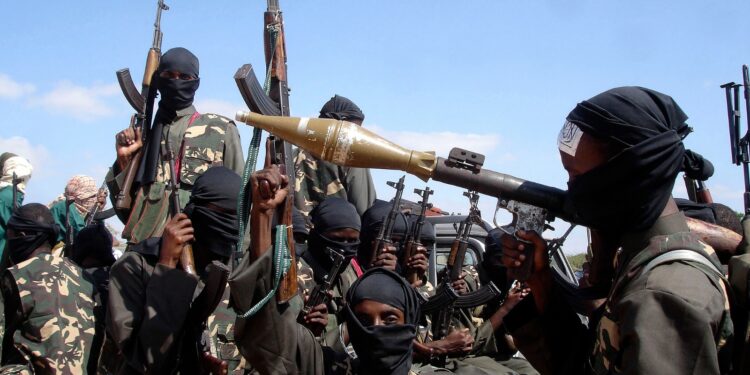 File Photo: Armed al-Shabab fighters ride on pickup trucks outside Mogadishu, Somalia, on December 8, 2008. /CFP