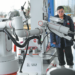 A refueling robot closes the fuel tank cap of a car at a gas station in Changsha, Hunan province. YANG HUAFENG/CHINA NEWS SERVICE
