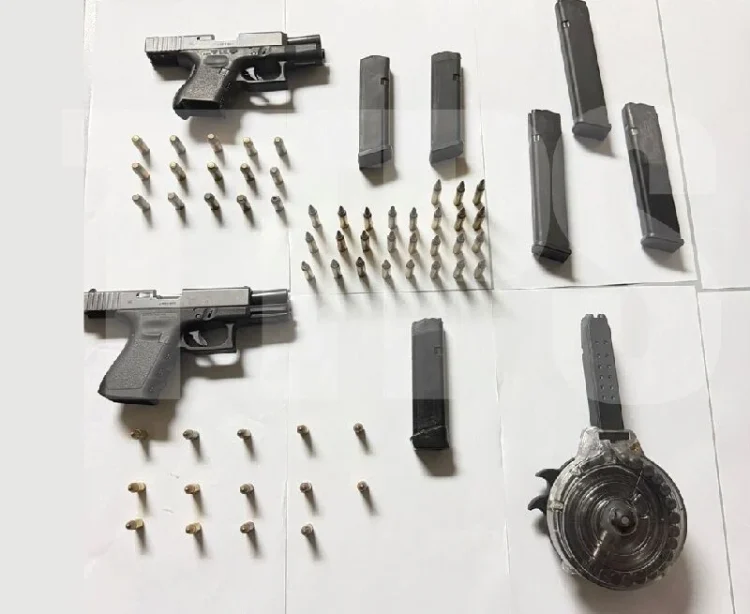 (flashback)firearms, magazines and ammunition recovered after a Highway Patrol South Operations Team intercepted a white Kia K2700 with three men on Tuesday. These were from the theft of guns and ammunition from the San Fernando Municipal Police Station on Sunday. In total, 43 firearms and over 900 rounds of assorted ammunition have been recovered.