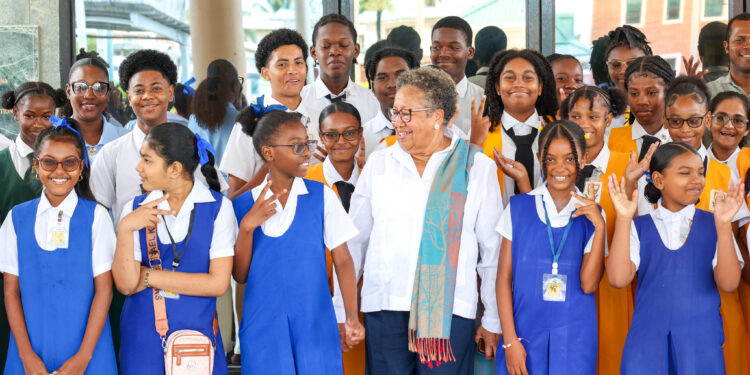 Dr. Carla Barnett, CARICOM Secretary-General shares a light moment with students at the Girls in ICT Day 2026 activities at the CARICOM Secretariat, Thursday, 23 April 2026