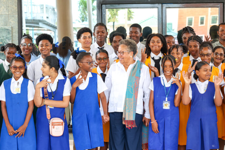 Dr. Carla Barnett, CARICOM Secretary-General shares a light moment with students at the Girls in ICT Day 2026 activities at the CARICOM Secretariat, Thursday, 23 April 2026