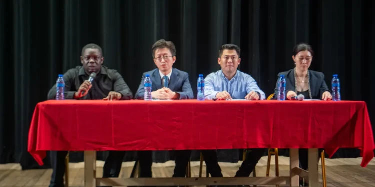 Seated from left, Andrew Tyndall, Director of National Events; Deputy Chief of Mission at the Chinese Embassy, Huang Rui; Director of the Hebei Acrobatic Group, Li Ming