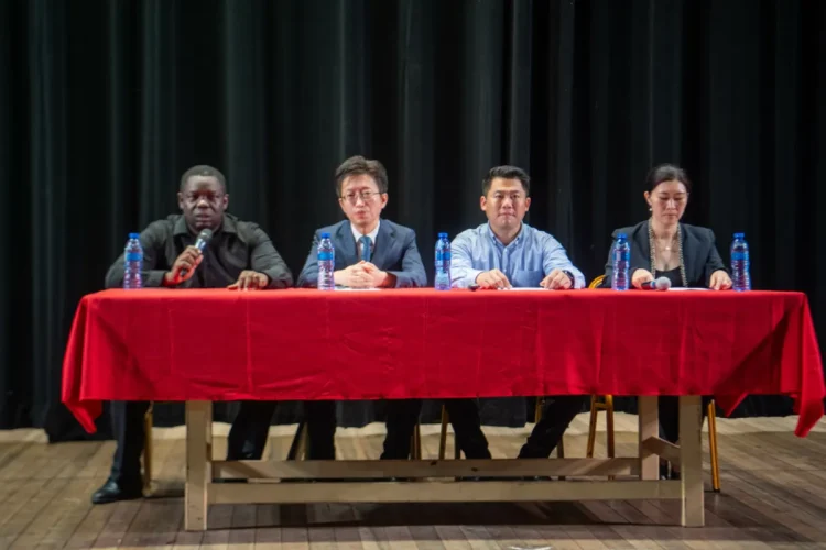 Seated from left, Andrew Tyndall, Director of National Events; Deputy Chief of Mission at the Chinese Embassy, Huang Rui; Director of the Hebei Acrobatic Group, Li Ming
