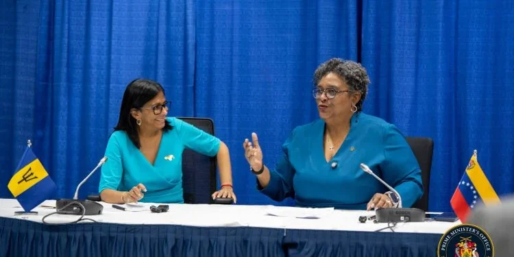 In this official Barbados government picture, Venezuela’s President, Delcy Rodriguez is seen wearing a brooch depicting a map of Venezuela that includes Guyana’s Essequibo Region as she interacts with the Prime Minister of Barbados, Mia Mottley.
