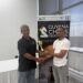 FM Anthony Drayton (R) recieves his championship trophy from Mr. John Lee, FIDE Arbiter