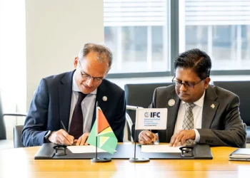 Senior Minister in the Office of the President with responsibility for Finance, Dr Ashni Singh, alongside International Finance Corporation Vice President for Europe, Latin America and the Caribbean, Alfonso García Mora, during the signing of the agreement