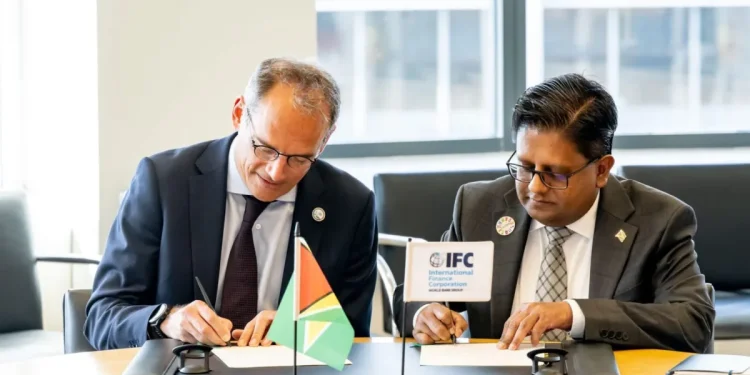 Senior Minister in the Office of the President with responsibility for Finance, Dr Ashni Singh, alongside International Finance Corporation Vice President for Europe, Latin America and the Caribbean, Alfonso García Mora, during the signing of the agreement