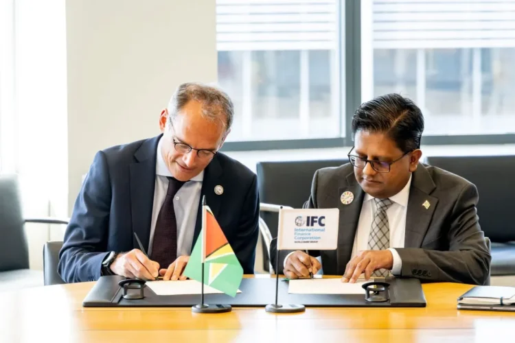 Senior Minister in the Office of the President with responsibility for Finance, Dr Ashni Singh, alongside International Finance Corporation Vice President for Europe, Latin America and the Caribbean, Alfonso García Mora, during the signing of the agreement
