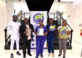 (L-R) Chief Executive Officer and Medical Officer, Dr Allan Outridge, of Empire Medical Centre Laboratory and other staff of the laboratory with the GYS 170 Certificate