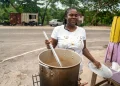 Sean Blake, who runs a cookshop at Gutters received a stove and other inputs to restart her business. She is back on her feet serving up customers