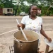 Sean Blake, who runs a cookshop at Gutters received a stove and other inputs to restart her business. She is back on her feet serving up customers