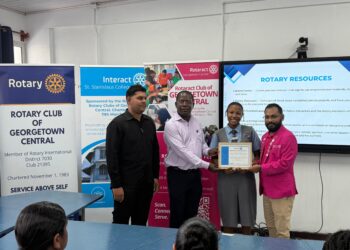 From the Left-Interact Club of St. Stanislaus College Advisor Emanuel
Narine, Rotary Club of Georgetown Central President Lloyd David,
Charter President Interact Club of St. Stanislaus College, Makeena Howard,
Rotaract Club of Georgetown President Harrinarine Balram