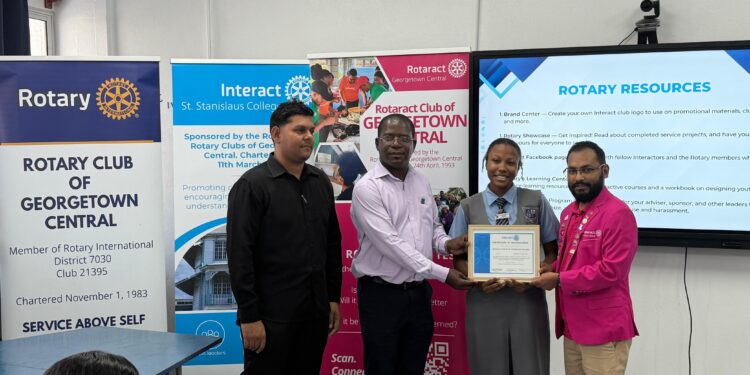 From the Left-Interact Club of St. Stanislaus College Advisor Emanuel
Narine, Rotary Club of Georgetown Central President Lloyd David,
Charter President Interact Club of St. Stanislaus College, Makeena Howard,
Rotaract Club of Georgetown President Harrinarine Balram