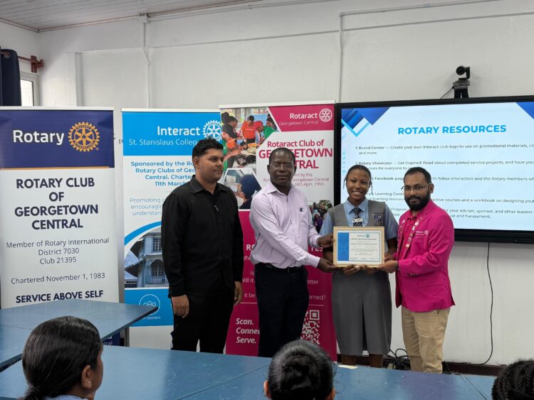 From the Left-Interact Club of St. Stanislaus College Advisor Emanuel
Narine, Rotary Club of Georgetown Central President Lloyd David,
Charter President Interact Club of St. Stanislaus College, Makeena Howard,
Rotaract Club of Georgetown President Harrinarine Balram