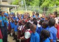 United Nations Anthurium Lewis (left) addresses pupils at a school in Tobago.