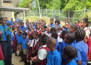 United Nations Anthurium Lewis (left) addresses pupils at a school in Tobago.