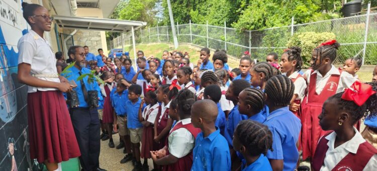 United Nations Anthurium Lewis (left) addresses pupils at a school in Tobago.