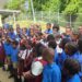 United Nations Anthurium Lewis (left) addresses pupils at a school in Tobago.