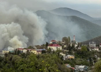 Smoke rises above buildings following a recent drone attack on the Tuapse oil refinery in Tuapse, Krasnodar region on April 29, 2026, amid the ongoing Russian-Ukrainian conflict. Stringer/AFP/Getty Images
