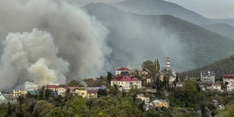 Smoke rises above buildings following a recent drone attack on the Tuapse oil refinery in Tuapse, Krasnodar region on April 29, 2026, amid the ongoing Russian-Ukrainian conflict. Stringer/AFP/Getty Images