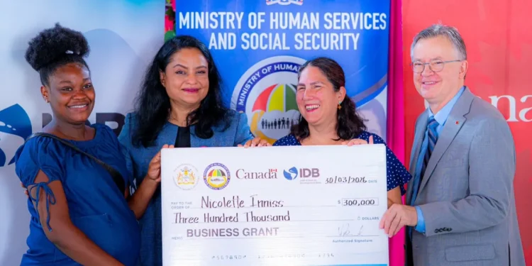 Ministry of Human Services and Social Security Dr Vindhya Persaud, alongside IDB Country Representative Lorena Salazar and Political Counsellor at the High Commission of Canada, Daniel Bood, handing over the grant
