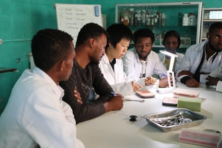 Chinese instructor Ma Yujie (3rd L) demonstrates surgical suturing skills at a lab of Holeta Polytechnic College in the Holeta town of Oromia region, Ethiopia, May 14, 2026. (Xinhua/Liu Fangqiang)