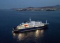 A general view of the cruise ship MV Hondius, while stationary off the port of Praia, the capital of Cape Verde, on May 6, 2026. Two seriously ill crew members on a cruise ship stricken by a deadly hantavirus outbreak will be evacuated via Cape Verde to the Netherlands, allowing the vessel to sail on to Spain's Canary Islands, the ship operator said on May 5, 2026.
The MV Hondius has been at the centre of an international health scare since Saturday, when WHO was informed that the rare disease -- usually spread from infected rodents typically through urine, droppings and saliva -- was suspected of being behind the deaths of three of its passengers.
As others fell ill, passengers and crew have been in isolation after Cape Verde authorities barred the ship from docking, and as health authorities scrambled to find a port that would take the Hondius. (Photo by AFP)