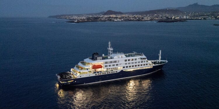 A general view of the cruise ship MV Hondius, while stationary off the port of Praia, the capital of Cape Verde, on May 6, 2026. Two seriously ill crew members on a cruise ship stricken by a deadly hantavirus outbreak will be evacuated via Cape Verde to the Netherlands, allowing the vessel to sail on to Spain's Canary Islands, the ship operator said on May 5, 2026.
The MV Hondius has been at the centre of an international health scare since Saturday, when WHO was informed that the rare disease -- usually spread from infected rodents typically through urine, droppings and saliva -- was suspected of being behind the deaths of three of its passengers.
As others fell ill, passengers and crew have been in isolation after Cape Verde authorities barred the ship from docking, and as health authorities scrambled to find a port that would take the Hondius. (Photo by AFP)