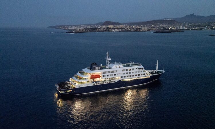 A general view of the cruise ship MV Hondius, while stationary off the port of Praia, the capital of Cape Verde, on May 6, 2026. Two seriously ill crew members on a cruise ship stricken by a deadly hantavirus outbreak will be evacuated via Cape Verde to the Netherlands, allowing the vessel to sail on to Spain's Canary Islands, the ship operator said on May 5, 2026.
The MV Hondius has been at the centre of an international health scare since Saturday, when WHO was informed that the rare disease -- usually spread from infected rodents typically through urine, droppings and saliva -- was suspected of being behind the deaths of three of its passengers.
As others fell ill, passengers and crew have been in isolation after Cape Verde authorities barred the ship from docking, and as health authorities scrambled to find a port that would take the Hondius. (Photo by AFP)