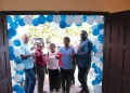 Minister of Health Dr Frank Anthony, flanked by regional officials, cuts the ceremonial ribbon for the drugs bond