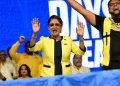 IN A CELEBRATORY MOOD: Prime Minister Kamla Persad-Bissessar makes a joyful noise as she celebrates on Saturday at the UNC’s congress meeting and one-year anniversary celebration in Couva. —Photo: JERMAINE CRUICKSHANK