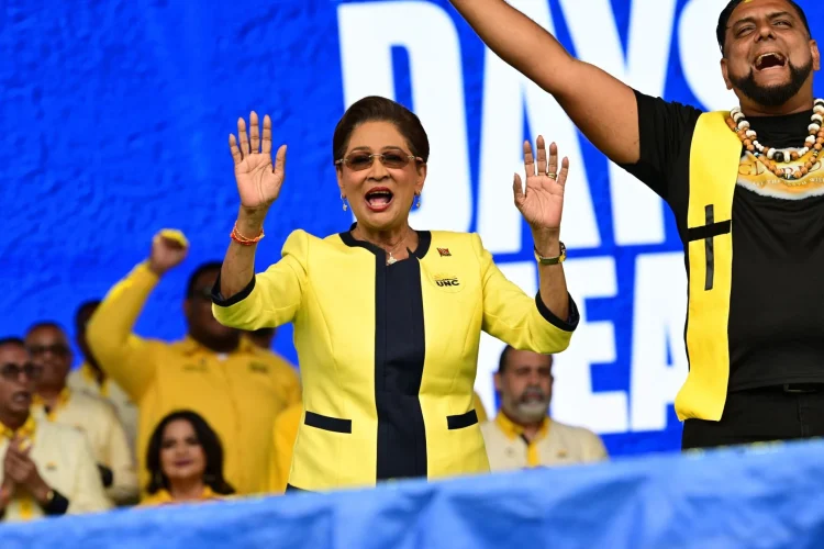 IN A CELEBRATORY MOOD: Prime Minister Kamla Persad-Bissessar makes a joyful noise as she celebrates on Saturday at the UNC’s congress meeting and one-year anniversary celebration in Couva. —Photo: JERMAINE CRUICKSHANK