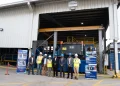 From right - CEO of GYSBI, Oliver Kassam, General Manager of SES, Kevin Balgobin, Senior Petroleum Coordinator at MNR, Bobby Gossai Jr., Chairman of SES, Dr. Komal Singh, Logistics Operations Superintendent at ExxonMobil Guyana, Natina Singh, Service Manager at NOV, Kushnarine Singh, standing in front of the newly commissioned system at SES
