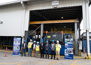 From right - CEO of GYSBI, Oliver Kassam, General Manager of SES, Kevin Balgobin, Senior Petroleum Coordinator at MNR, Bobby Gossai Jr., Chairman of SES, Dr. Komal Singh, Logistics Operations Superintendent at ExxonMobil Guyana, Natina Singh, Service Manager at NOV, Kushnarine Singh, standing in front of the newly commissioned system at SES