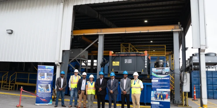 From right - CEO of GYSBI, Oliver Kassam, General Manager of SES, Kevin Balgobin, Senior Petroleum Coordinator at MNR, Bobby Gossai Jr., Chairman of SES, Dr. Komal Singh, Logistics Operations Superintendent at ExxonMobil Guyana, Natina Singh, Service Manager at NOV, Kushnarine Singh, standing in front of the newly commissioned system at SES