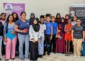 Girls' Chess Camp participants with coaches