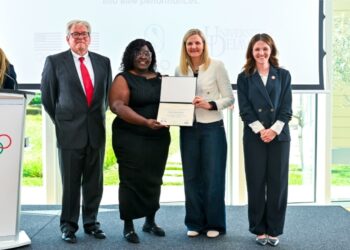 ICECP Program Kenisha Headley receiving certificate from IOC President Kirsty Coventry