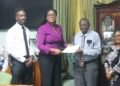 FGM Parliamentarian Amanza Walton-Desir hands over petition to Clerk of the Assembly Sherlock Isaacs