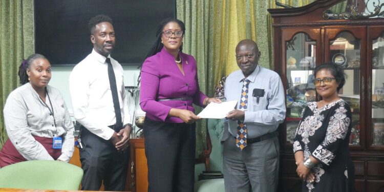 FGM Parliamentarian Amanza Walton-Desir hands over petition to Clerk of the Assembly Sherlock Isaacs