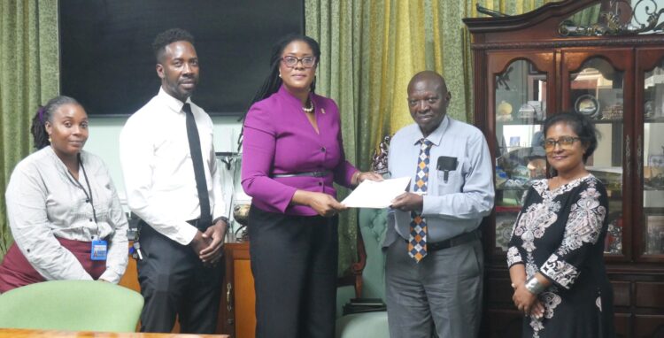 FGM Parliamentarian Amanza Walton-Desir hands over petition to Clerk of the Assembly Sherlock Isaacs